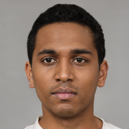 Neutral black young-adult male with short  black hair and brown eyes