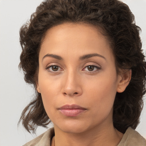 Neutral white young-adult female with medium  brown hair and brown eyes