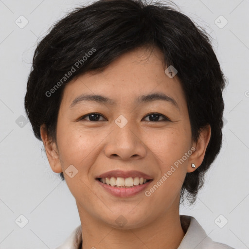 Joyful asian young-adult female with short  brown hair and brown eyes