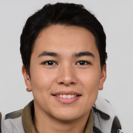 Joyful asian young-adult male with short  brown hair and brown eyes