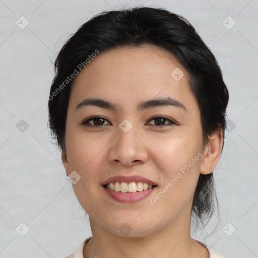 Joyful asian young-adult female with medium  black hair and brown eyes