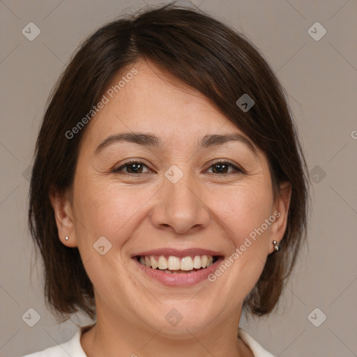 Joyful white adult female with medium  brown hair and brown eyes