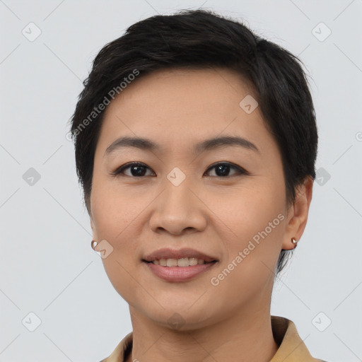 Joyful asian young-adult female with short  black hair and brown eyes