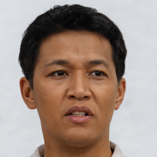 Neutral asian adult male with short  black hair and brown eyes