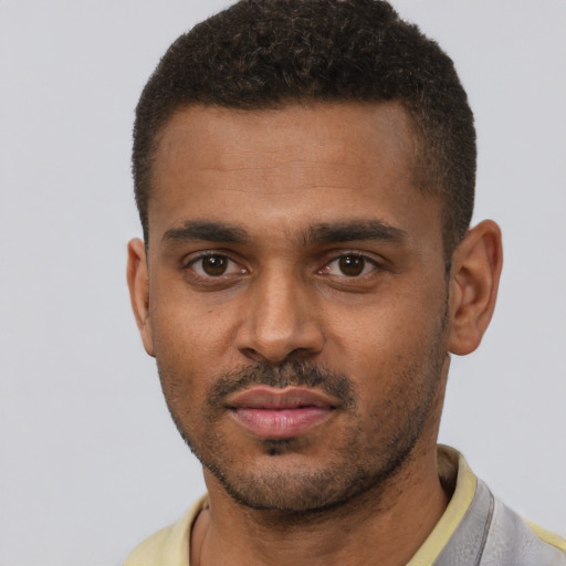 Neutral black young-adult male with short  black hair and brown eyes