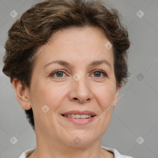 Joyful white adult female with short  brown hair and brown eyes