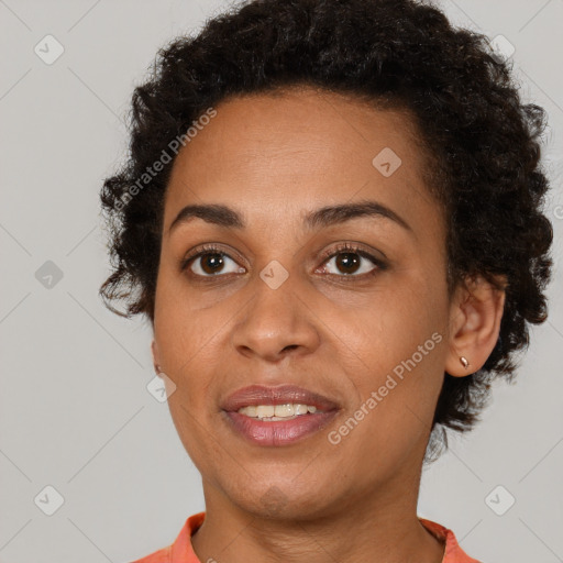 Joyful black young-adult female with short  brown hair and brown eyes