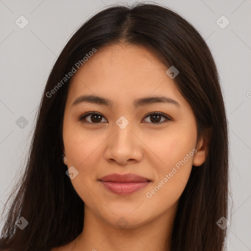 Joyful latino young-adult female with long  brown hair and brown eyes