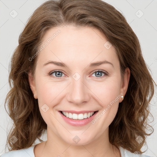 Joyful white young-adult female with long  brown hair and green eyes