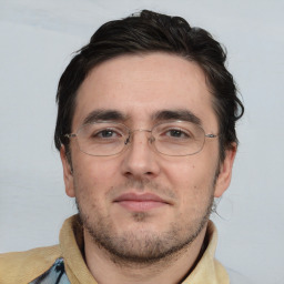 Neutral white adult male with short  black hair and brown eyes