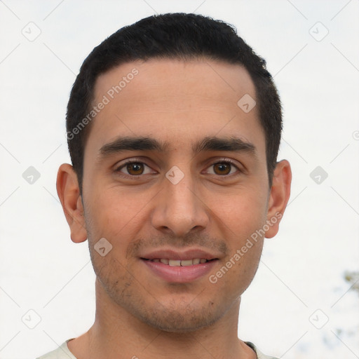 Joyful latino young-adult male with short  black hair and brown eyes