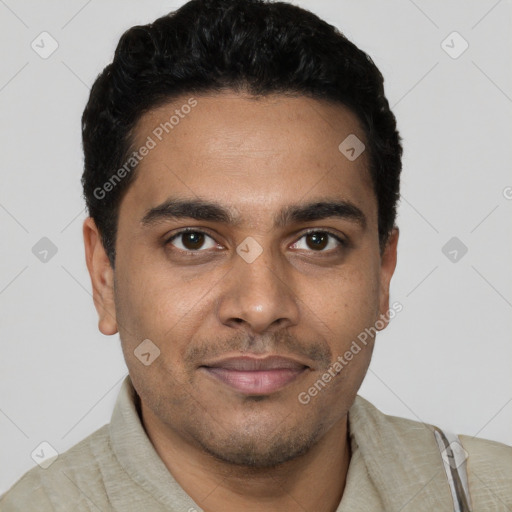 Joyful white young-adult male with short  black hair and brown eyes