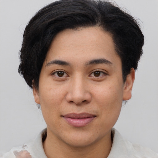 Joyful asian young-adult female with short  brown hair and brown eyes
