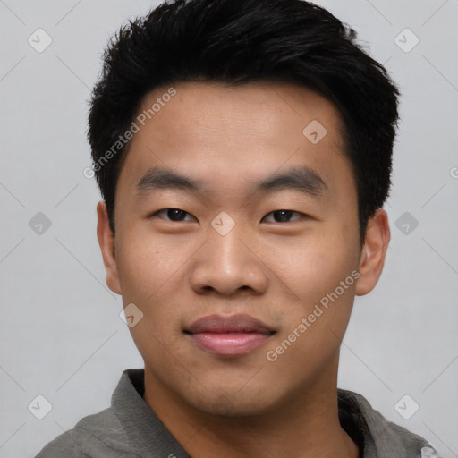 Joyful asian young-adult male with short  black hair and brown eyes