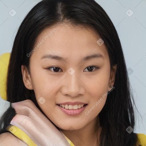 Joyful asian young-adult female with long  brown hair and brown eyes