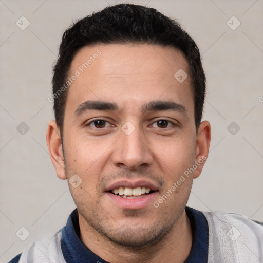 Joyful white young-adult male with short  black hair and brown eyes