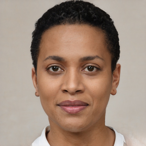 Joyful latino young-adult female with short  black hair and brown eyes