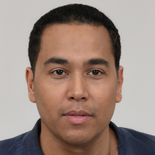 Neutral latino young-adult male with short  black hair and brown eyes