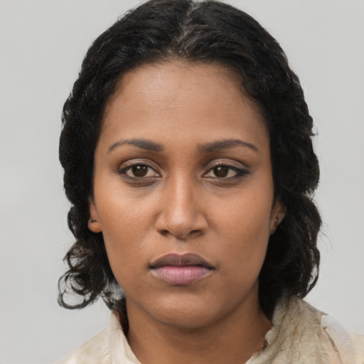 Neutral black young-adult female with long  brown hair and brown eyes