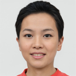 Joyful asian young-adult female with short  black hair and brown eyes