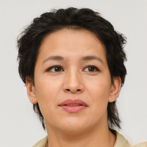 Joyful asian adult female with medium  brown hair and brown eyes
