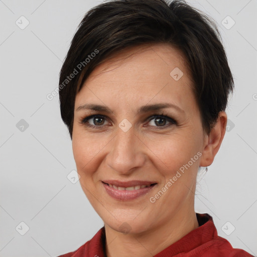 Joyful white adult female with short  brown hair and brown eyes