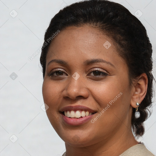 Joyful latino young-adult female with short  brown hair and brown eyes