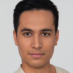 Neutral latino young-adult male with short  black hair and brown eyes