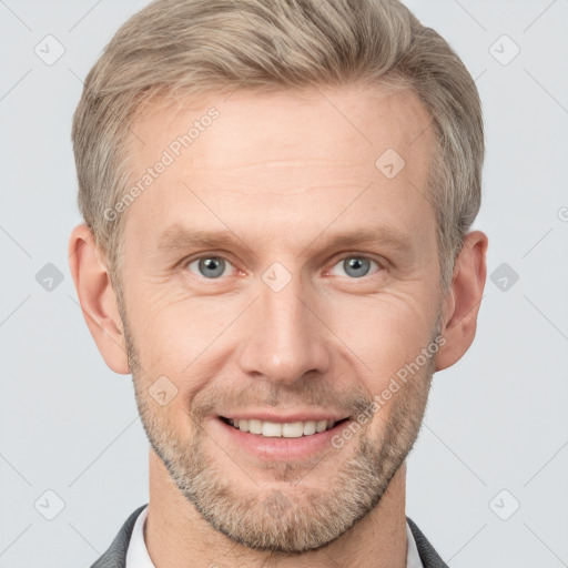 Joyful white adult male with short  brown hair and grey eyes