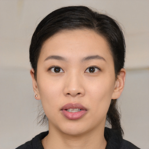 Neutral white young-adult female with medium  black hair and brown eyes