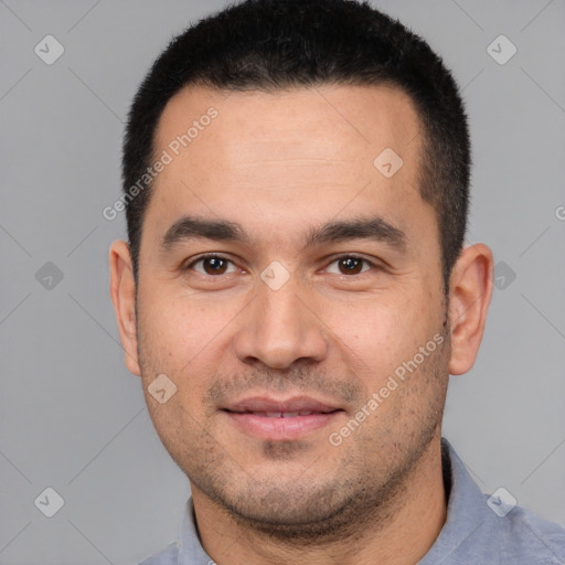 Joyful white young-adult male with short  black hair and brown eyes