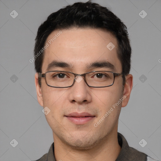 Joyful white young-adult male with short  black hair and brown eyes