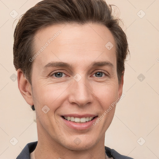 Joyful white adult male with short  brown hair and grey eyes