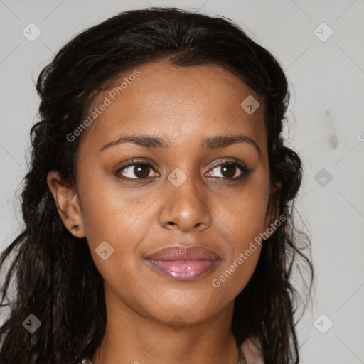 Joyful black young-adult female with long  brown hair and brown eyes