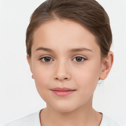 Joyful white child female with short  brown hair and brown eyes