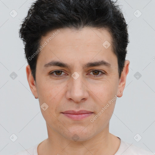 Joyful white young-adult male with short  black hair and brown eyes