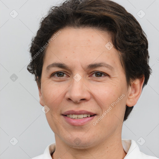 Joyful white adult female with short  brown hair and brown eyes