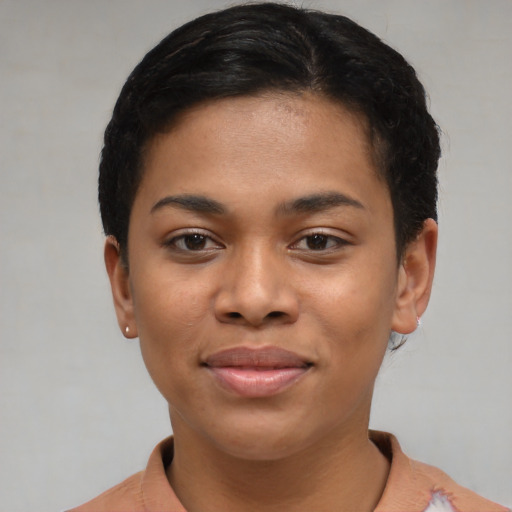 Joyful asian young-adult female with short  black hair and brown eyes
