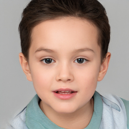 Joyful white child female with short  brown hair and brown eyes