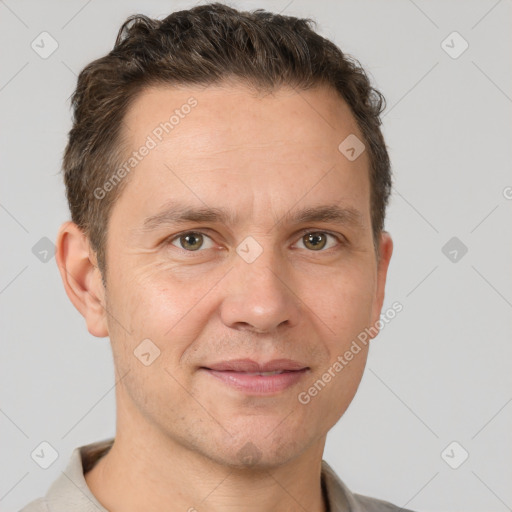 Joyful white adult male with short  brown hair and grey eyes