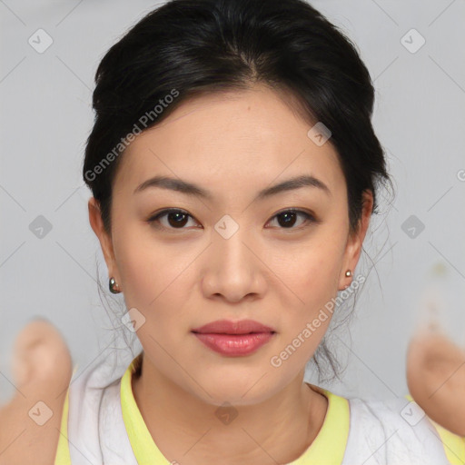 Joyful asian young-adult female with medium  brown hair and brown eyes