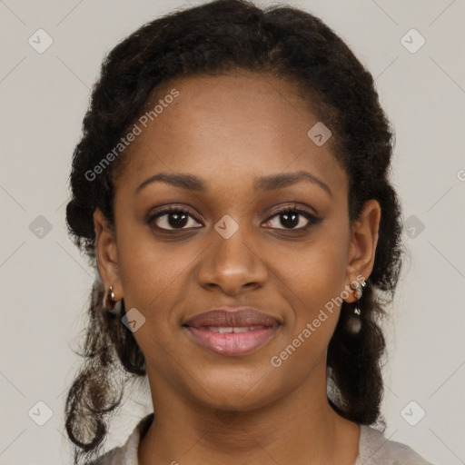 Joyful black young-adult female with long  brown hair and brown eyes