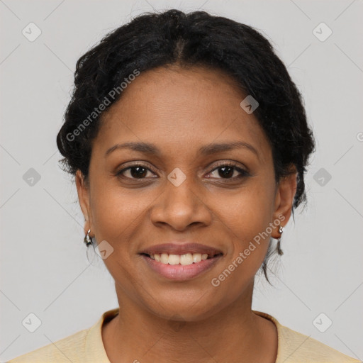 Joyful black young-adult female with short  brown hair and brown eyes