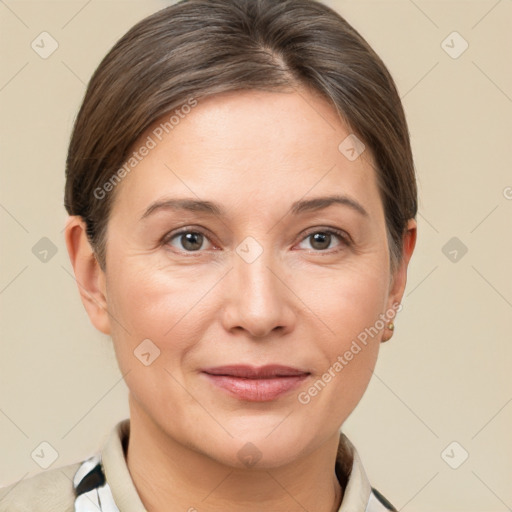 Joyful white adult female with short  brown hair and brown eyes