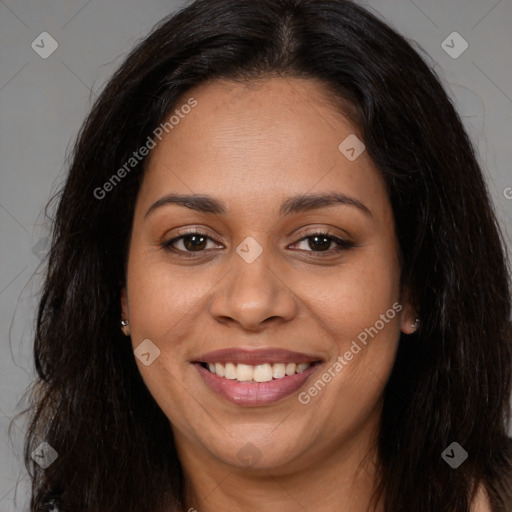 Joyful latino adult female with long  brown hair and brown eyes