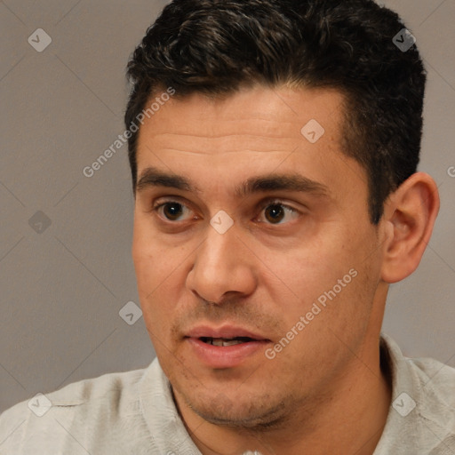 Joyful white adult male with short  brown hair and brown eyes