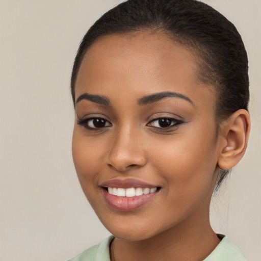 Joyful latino young-adult female with long  brown hair and brown eyes