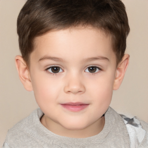 Joyful white child male with short  brown hair and brown eyes