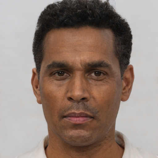 Neutral black adult male with short  black hair and brown eyes