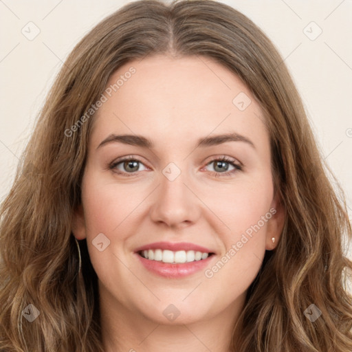 Joyful white young-adult female with long  brown hair and green eyes